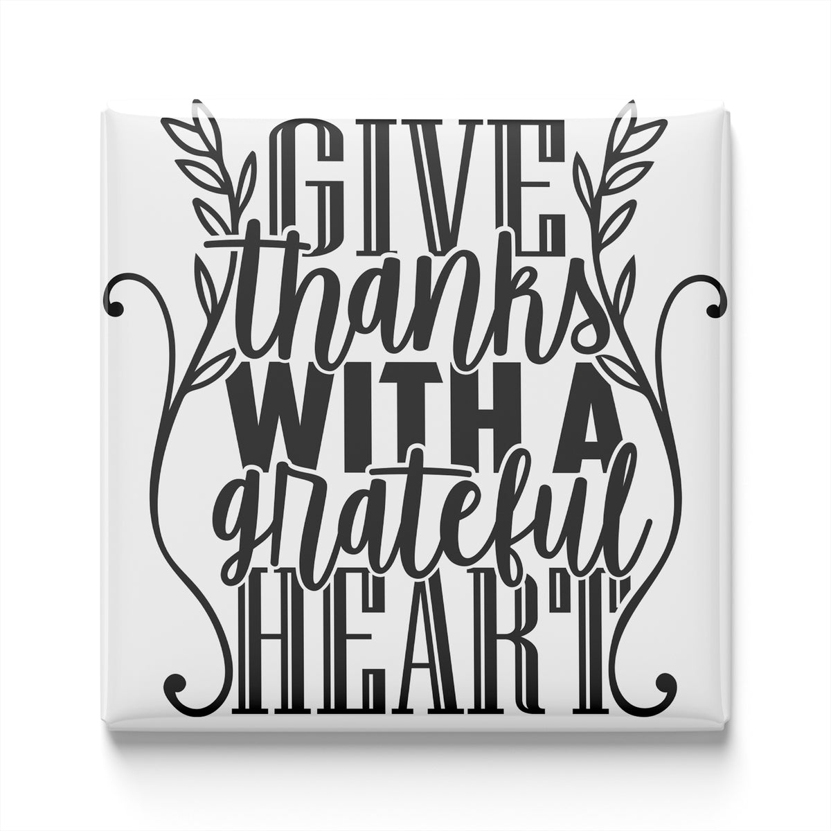 a graphic design with the text "GIVE thanks with a grateful heart" in a stylized font.