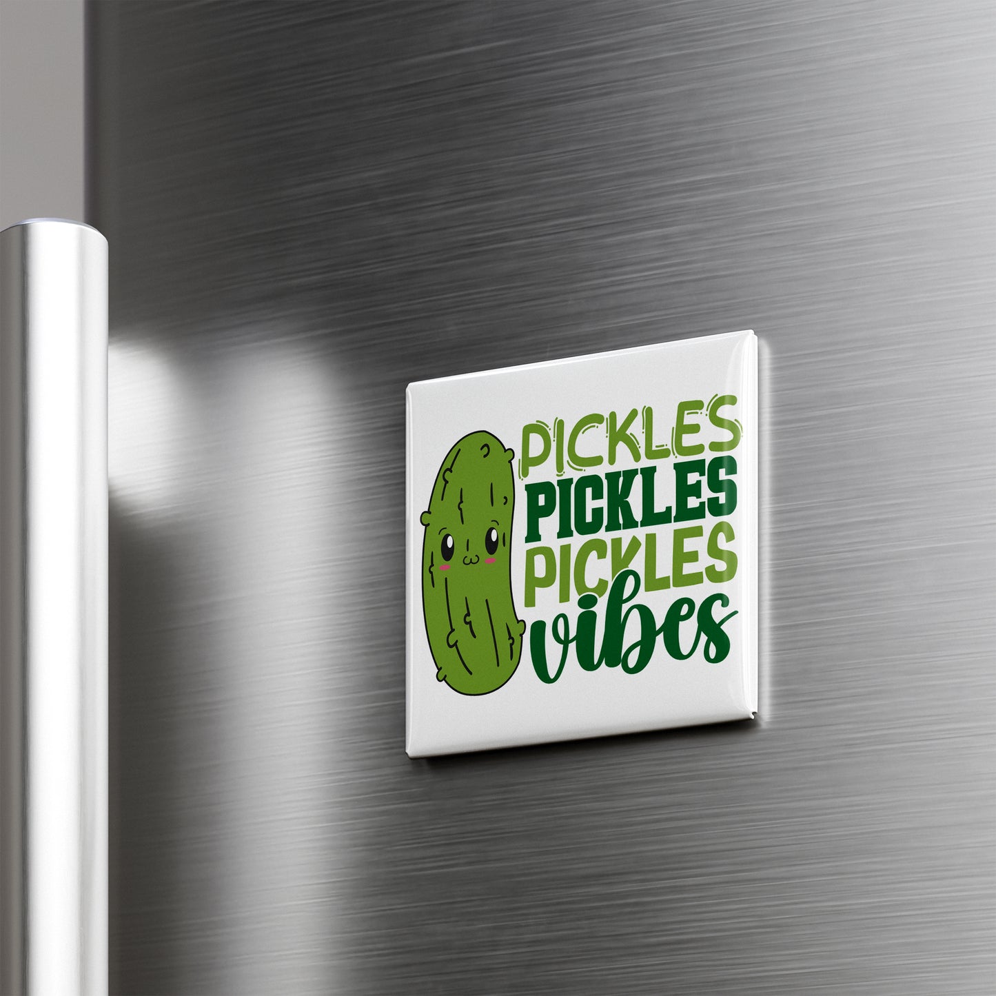 A refrigerator magnet with a cartoon pickle and the text "Pickles, Pickles, Vibes" written on it.