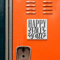a vibrant orange wall with a white sign that reads "HAPPY FALL Y'ALL".