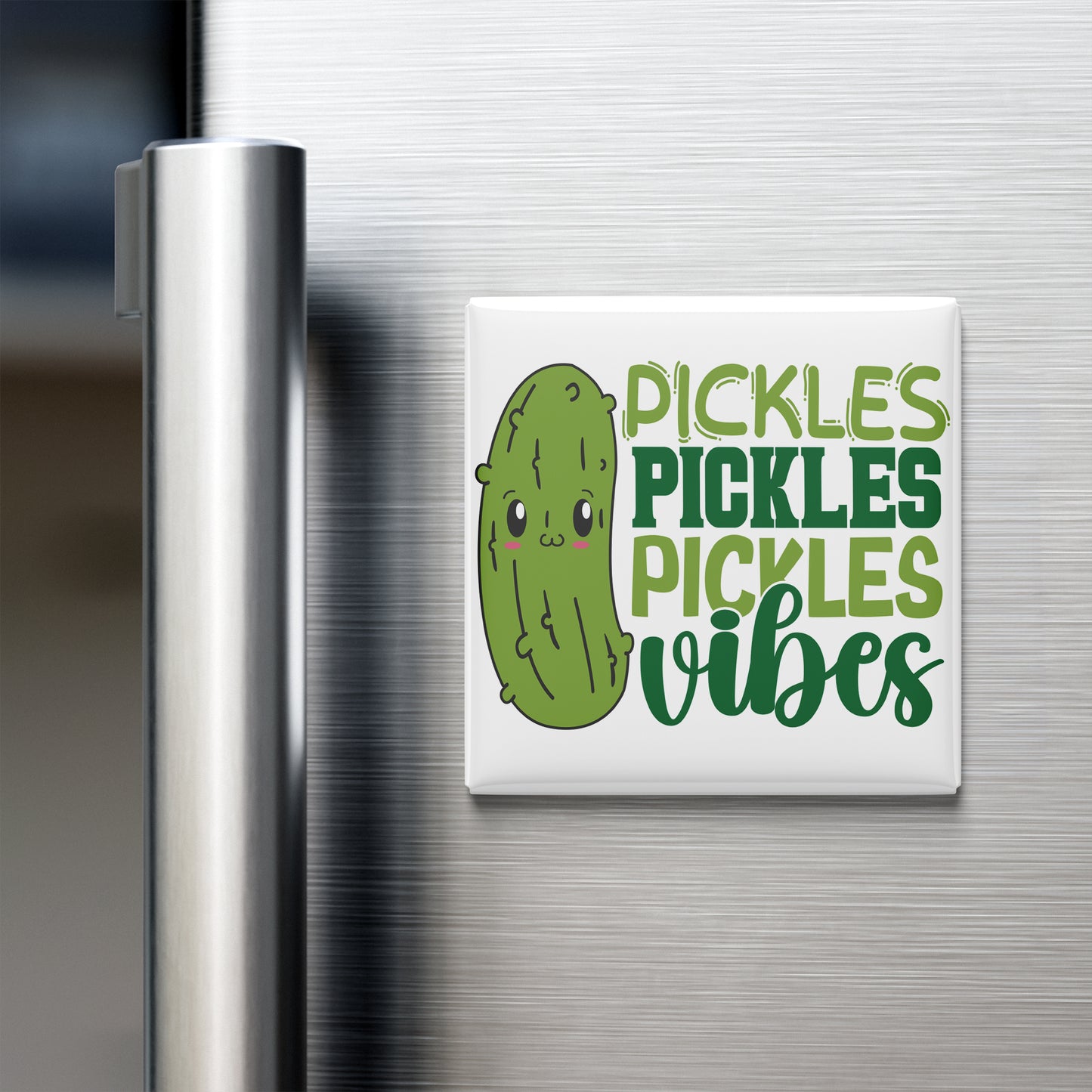 A refrigerator door with a magnet that says "Pickles, Pickles, Vibes" featuring a cartoon pickle.