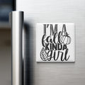 A refrigerator door with a magnet that says "I'm a fall kinda girl" in a stylized font.
