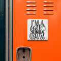 a vibrant orange wall with a white sticker that reads "I'm a fall kinda girl" in a playful, autumnal font.