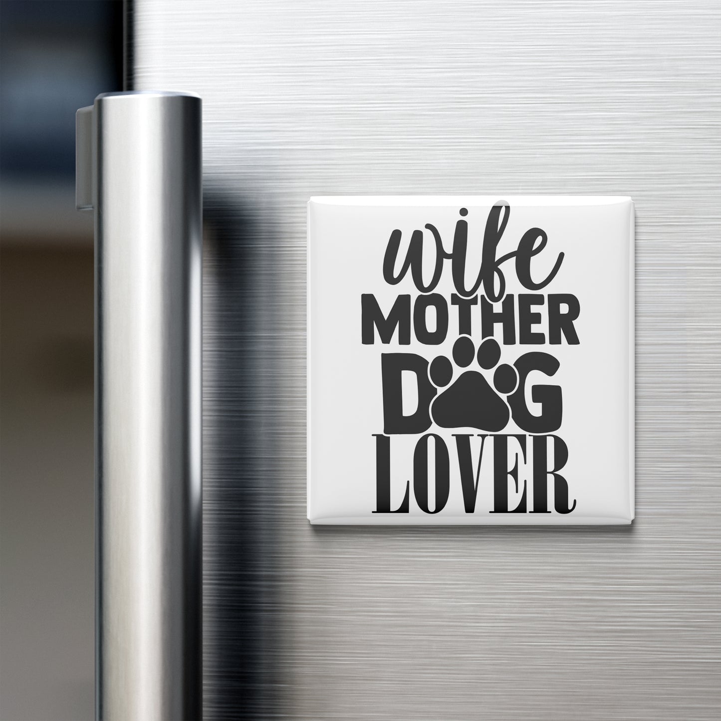 A white refrigerator magnet with the text "wife mother dog lover" printed on it.