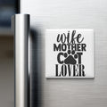 A white refrigerator magnet with the text "wife mother cat lover" printed on it.
