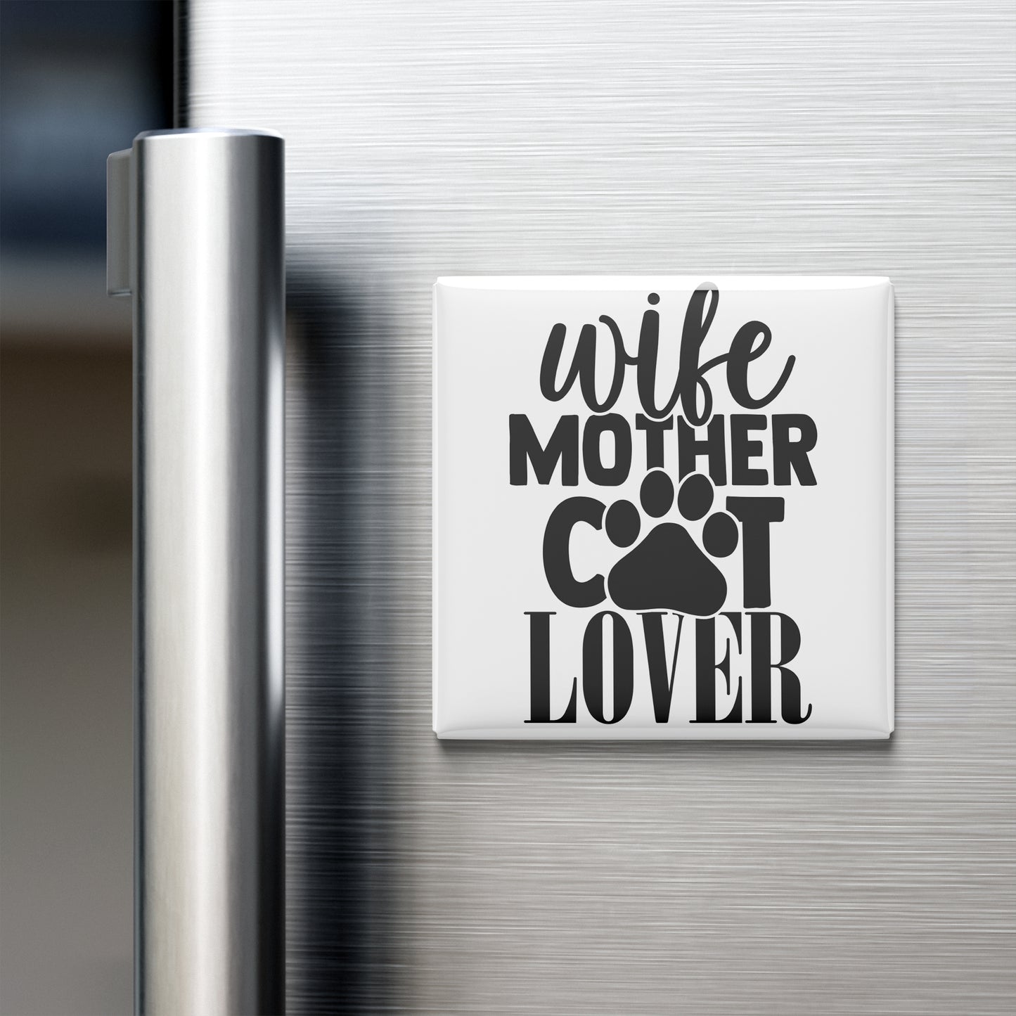 A white refrigerator magnet with the text "wife mother cat lover" printed on it.