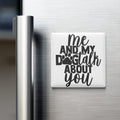 A white refrigerator magnet with the text "me and my dog talk about you" printed on it.