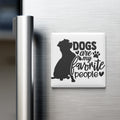 A refrigerator magnet with the text "Dogs are my favorite people" and a silhouette of a dog.