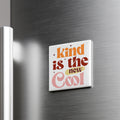 A white refrigerator magnet with the text "Kind is the new cool" in a colorful, retro-style font.