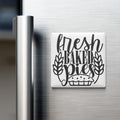 A refrigerator door with a magnet that says "fresh baked pies".