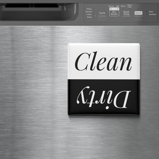 a black and white sign with the word "Clean" written on it, placed on a stainless steel surface.