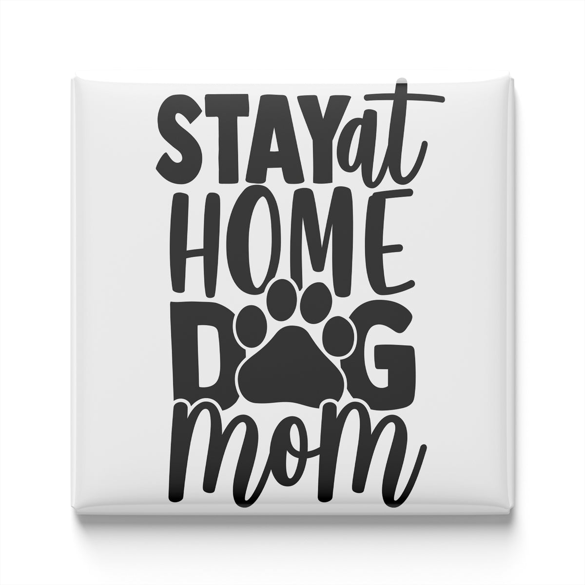 the text "STAYAT HOME DOGM mom" in a stylized font, with a paw print symbol below the text.