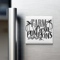 A refrigerator door with a magnet that says "FARM FRESH PUMPKINS" in a stylized font.