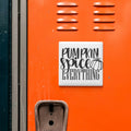 a vibrant orange wall with a white sign that reads "Pumpkin spice everything" in bold black text.