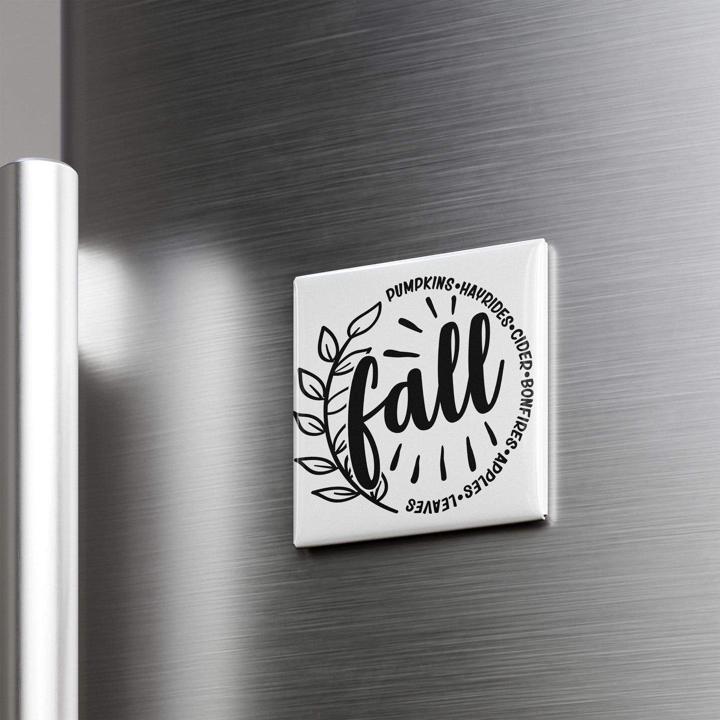 A white refrigerator magnet with the word "fall" written on it.