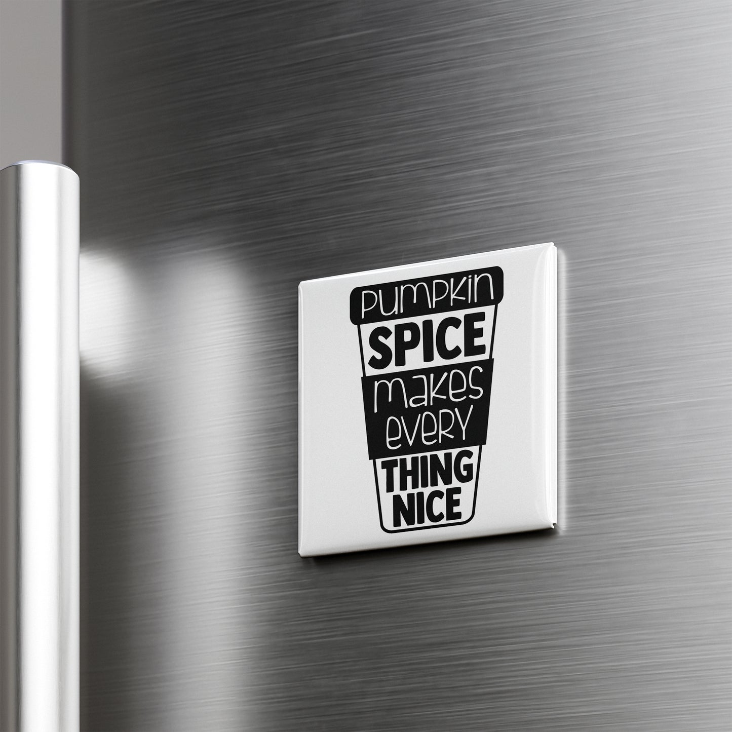 A white refrigerator magnet with the text "Pumpkin spice makes everything thing nice" printed on it.