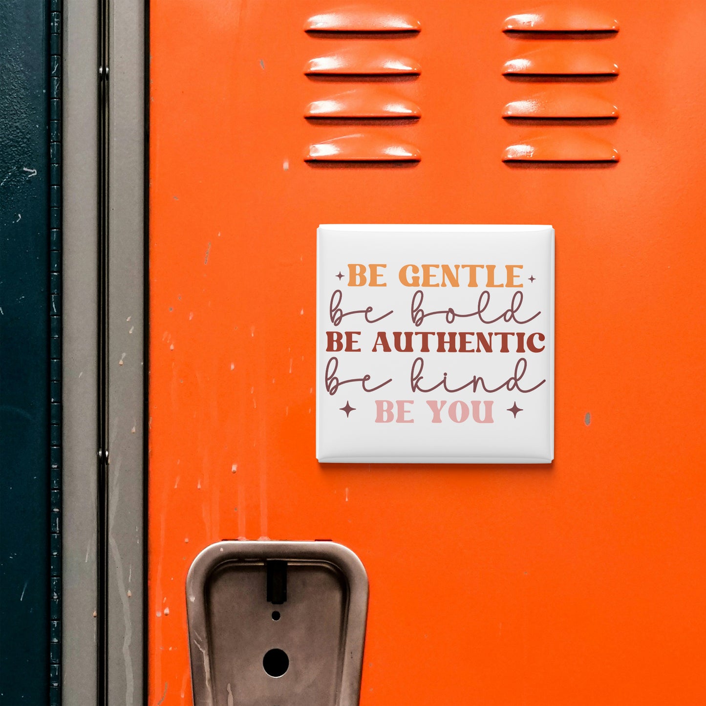 a vibrant orange wall with a motivational quote in white text that reads "Be Gentle, be Bold, be Authentic, be Kind, be You".