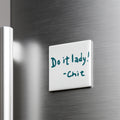 a white note attached to a metallic surface, which contains the text "Do it lady! - Chitch".