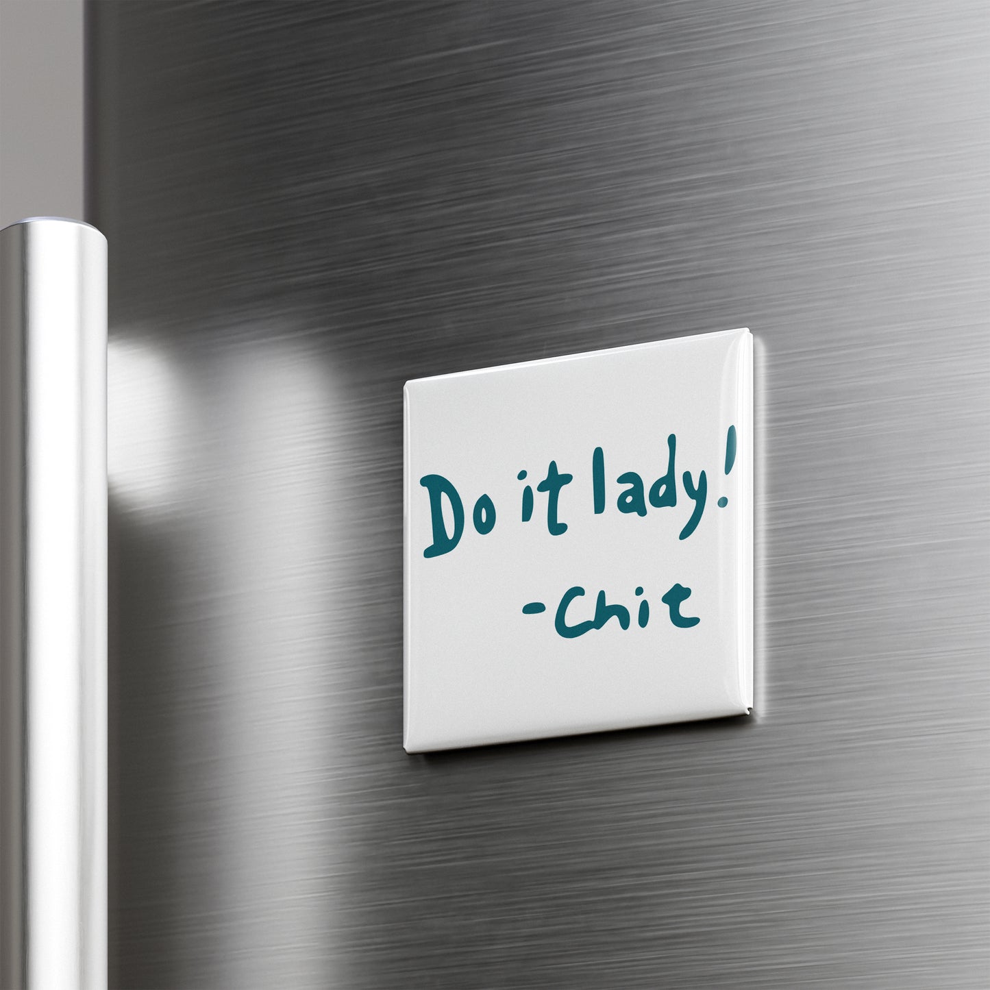a white note attached to a metallic surface, which contains the text "Do it lady! - Chitch".