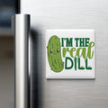 A refrigerator door with a magnet that says "I'm the real dill" in a playful, cartoonish font.