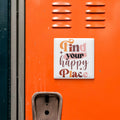 a vibrant orange wall with a motivational quote in the center, which reads "Find your happy place".