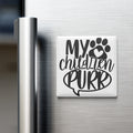 A white refrigerator magnet with the text "MY CHILDREN PURR" and a paw print graphic.