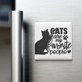 A white refrigerator magnet with the text "CATS are my favorite people" and a silhouette of a cat.
