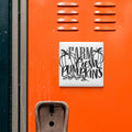 a vibrant orange wall with a white sign that reads "FARM FRESH PUMPKINS" in black text.