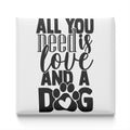 a message that reads "All you need is love and a dog" in a stylized font.