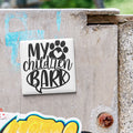 A sticker with the text "MY CHILDREN BARK" is attached to a concrete surface.
