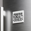 A white refrigerator magnet with the text "Pumpkin spice junkie" written on it.