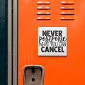 a sign with the text "NEVER postpone what you can CANCELL" on an orange surface, which appears to be a locker or a storage unit.