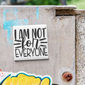 a sticker with the text "I AM NOT FOR EVERYONE" on a metal surface.