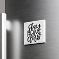 A white square magnet with the text "STAY HOME CLUB" written in a stylized font.