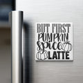 A white refrigerator magnet with the text "BUT FIRST PUMPKIN SPICE LATE" printed on it.