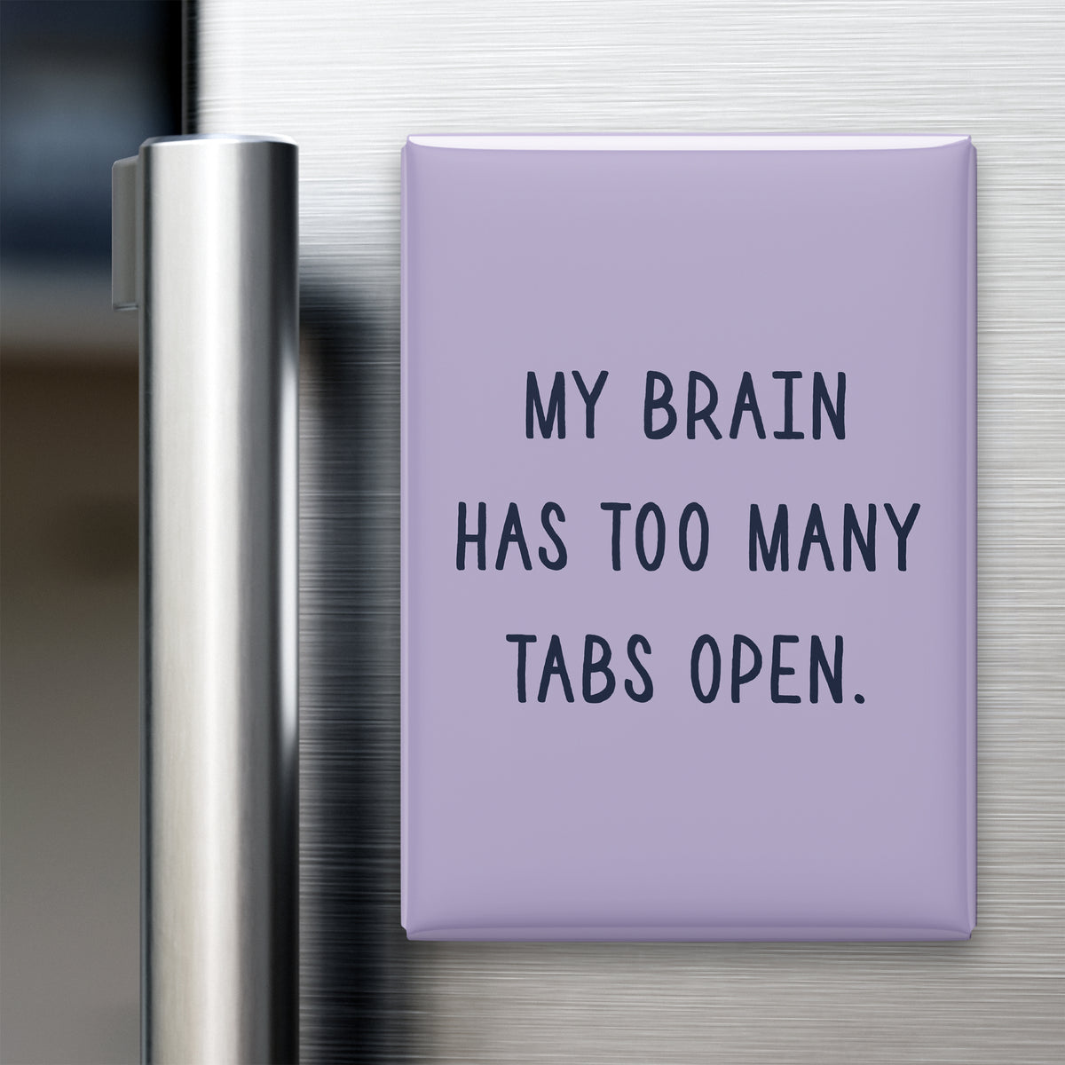 “My brain has too many tabs open.” quote magnet displayed on a refrigerator
