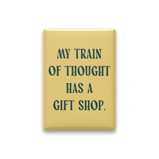 “My train of thought has a gift shop.” butter quote magnet on white