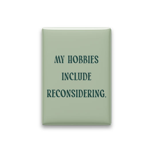 “My hobbies include reconsidering.” sage quote magnet on white