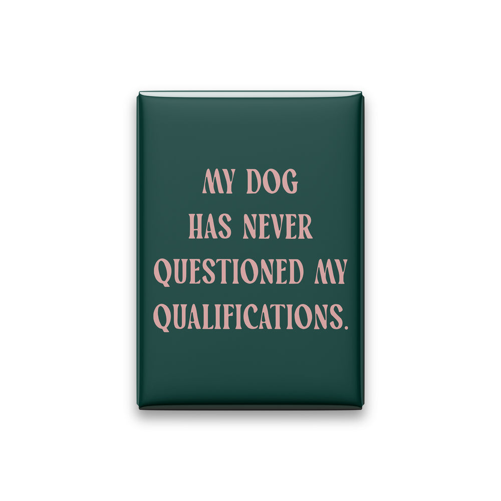 “My dog has never questioned my qualifications.” spruce quote magnet on white