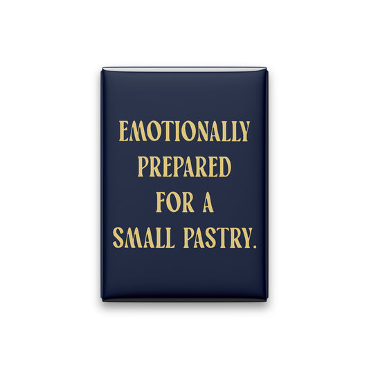 “Emotionally prepared for a small pastry.” midnight quote magnet on white