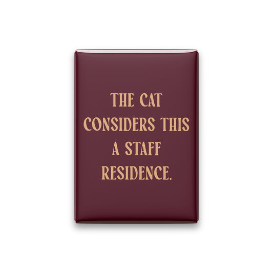 “The cat considers this a staff residence.” oxblood quote magnet on white