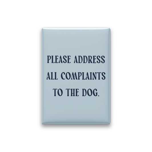 “Please address all complaints to the dog.” powder quote magnet on white