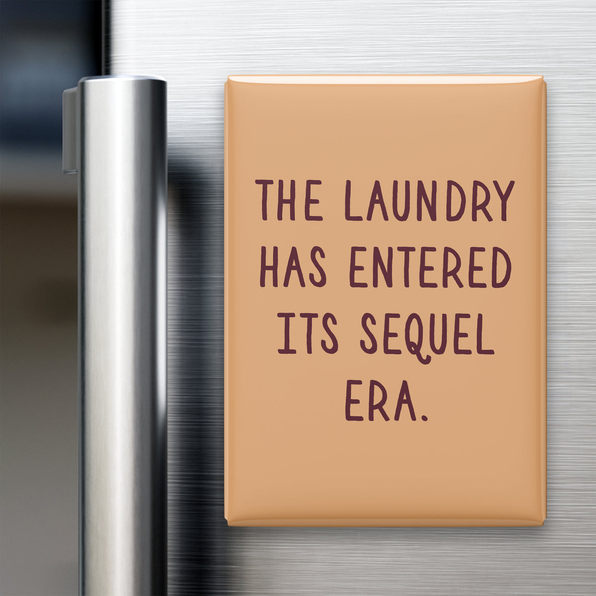 “The laundry has entered its sequel era.” quote magnet displayed on a refrigerator