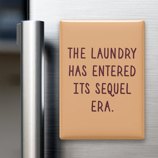 “The laundry has entered its sequel era.” quote magnet displayed on a refrigerator
