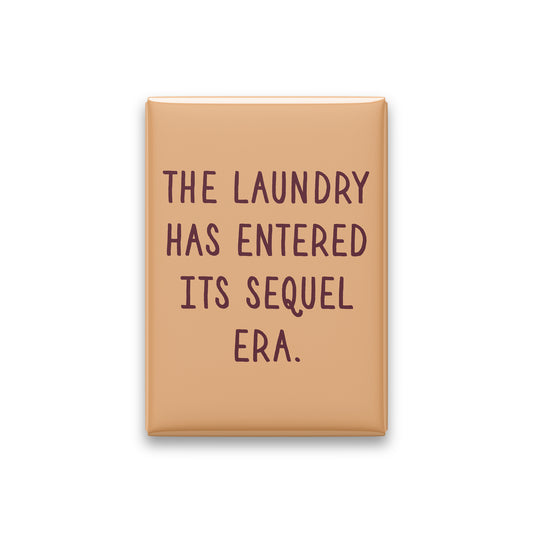 “The laundry has entered its sequel era.” apricot quote magnet on white