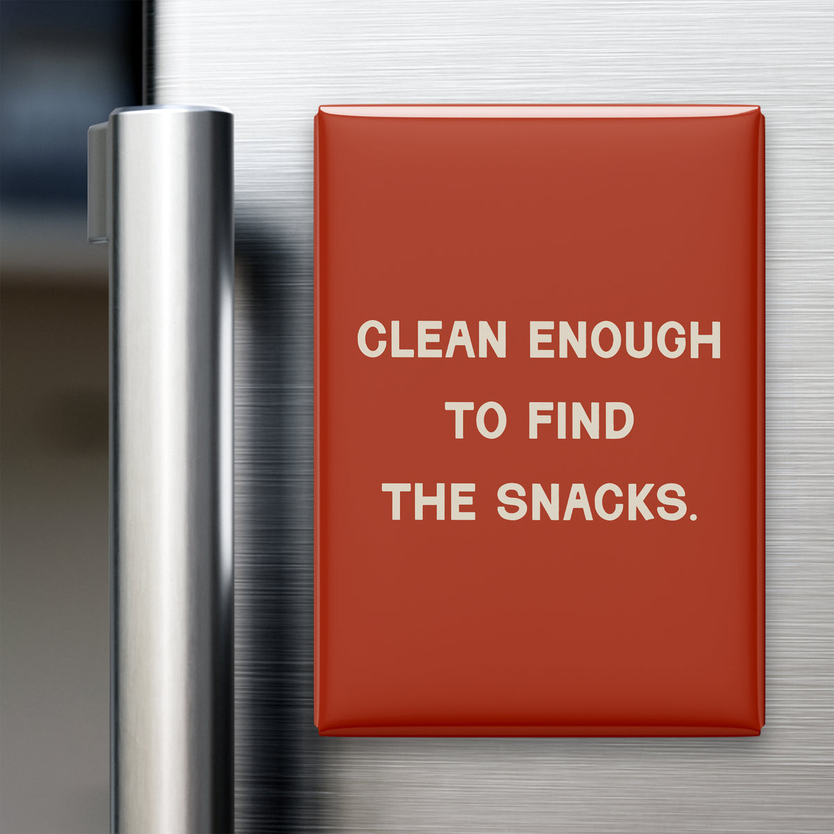 “Clean enough to find the snacks.” quote magnet displayed on a refrigerator