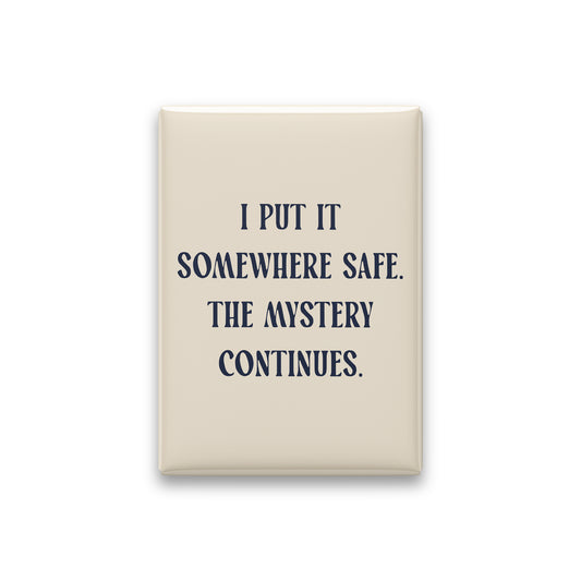 “I put it somewhere safe. The mystery continues.” parchment quote magnet on white