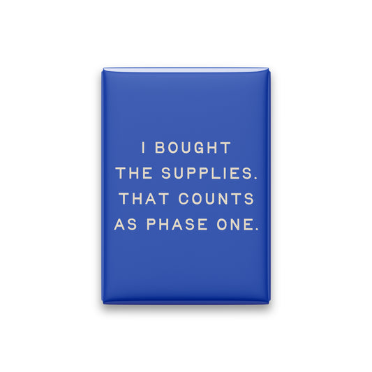 “I bought the supplies. That counts as phase one.” cobalt quote magnet on white