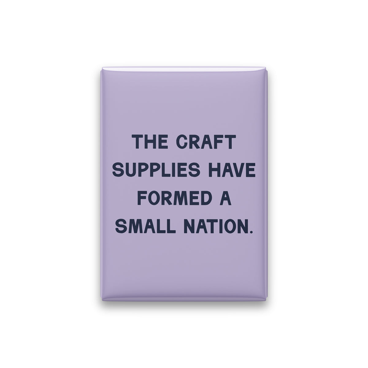 “The craft supplies have formed a small nation.” lilac quote magnet on white