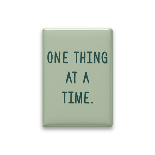 “One thing at a time.” sage quote magnet on white