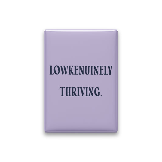 “Lowkenuinely thriving.” lilac quote magnet on white